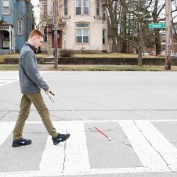 A pedestrian that is legally using a white cane